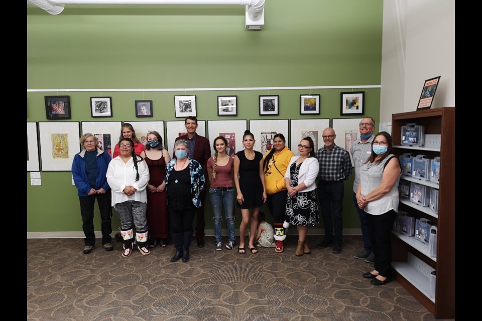 Group of artists and instructors and local leaders pose at closing ceremony for the Time Stamps: The Art of Relief exhibition on Aug. 27.