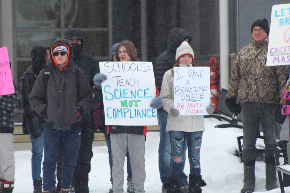 Roughly 12 to 20 high school students took part in the anti-mask rally.