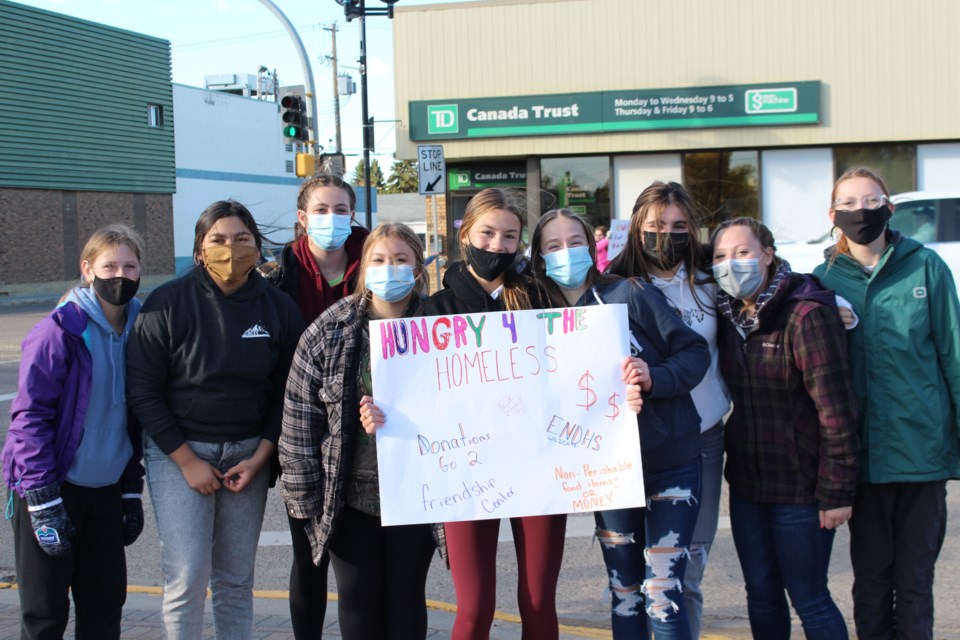 École Notre Dame High School students spent five hours outside of high-traffic locations in Bonnyville to cheer on and encourage community members to donate non-perishable food items and money for a good cause. 