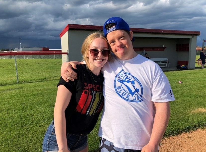 While still a high school student Erin Walker (left) volunteered in numerous clubs and programs ranging from environmental club to Challenger Baseball in Cold Lake.