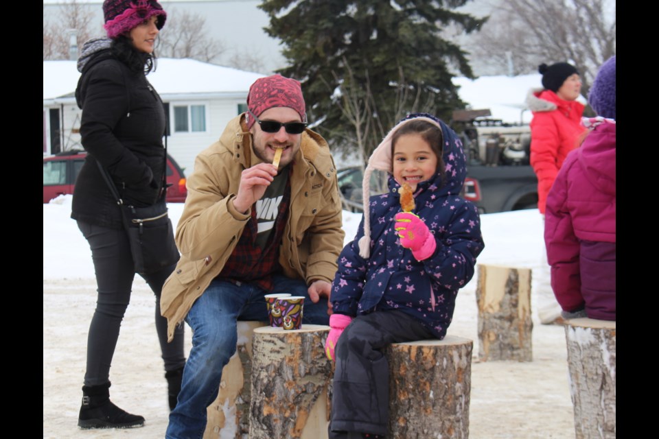 Tire sur la neige – maple taffy on a stick, was a popular treat at ACFA's event on Saturday.