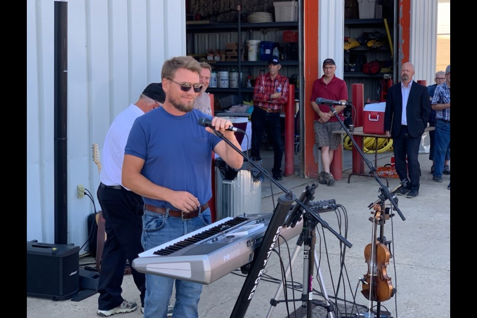 Lac La Biche County Mayor Paul Reutov congratulated the local gas co-op on its 50-year anniversary serving the community. Celebrating the milestone, county council also made a $500 donation to the local food bank on behalf of the co-op.