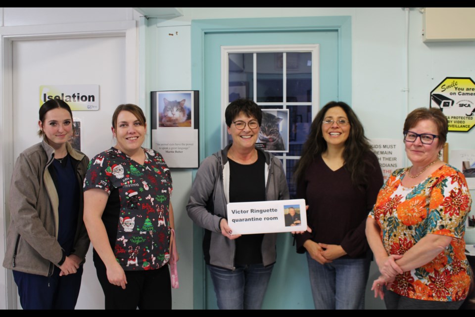 The late Victor Ringuette was memorialized by the Bonnyville and District SPCA with specialized animal care room named after him. Ringuette's daughter Roxanne (centre) was given the honour of hanging the name plaque. Pictured from left to right: Kalee Rupp, Ashely Hebert, Judith Rodriguez and Jean Littlewood.  