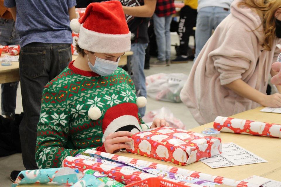 BCHS students are busy Dec. 13 wrapping gifts for the Santa's Elves program.