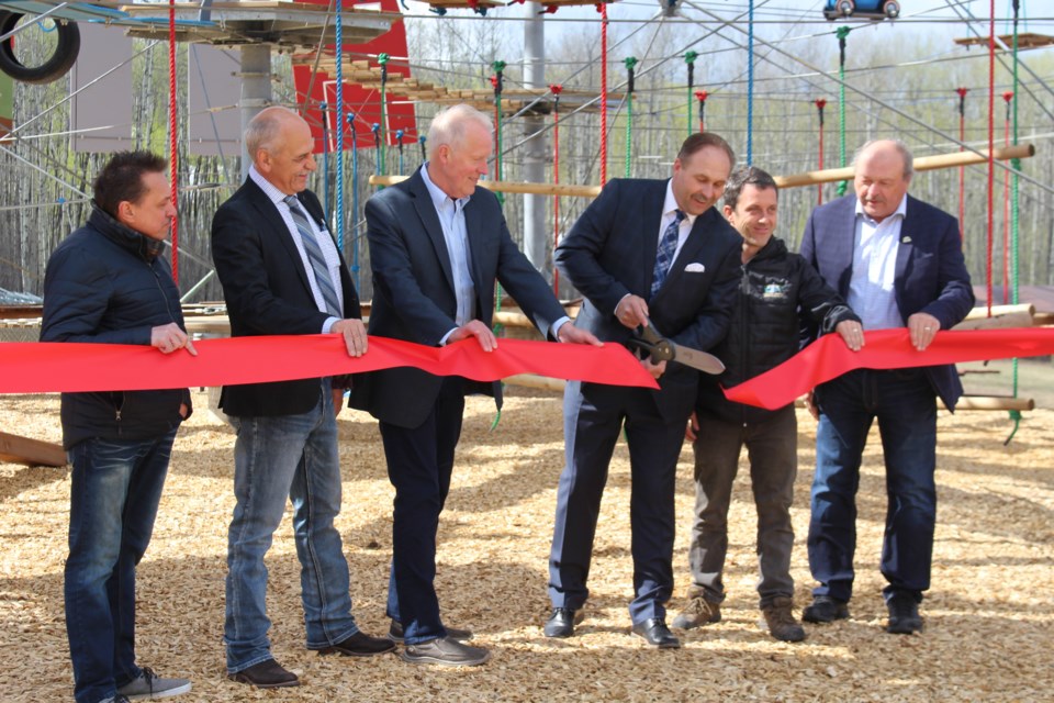 Md of Bonnyville council takes part in a ribbon cutting ceremony on May 19, officially marking the opening of Kinosoo Ridge Aerial Adventure Park.