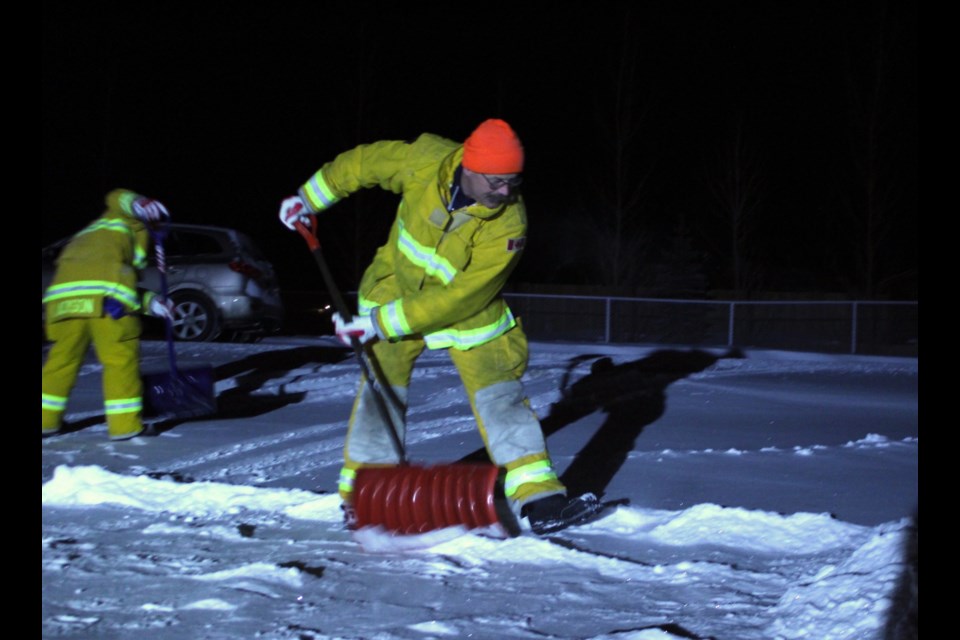 BRFA Fire Chief Craig Wenzel pitches in to remove snow from the walkway and driveways of Bonnyville residents unable to complete the work themselves. 