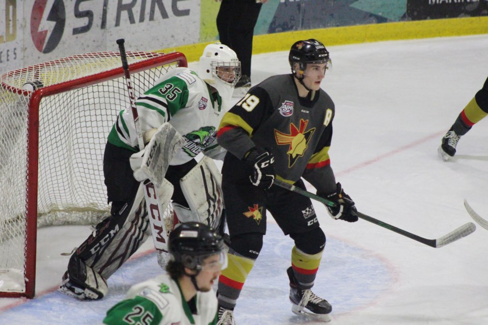 Pontiacs' left forward, Michael Fairfax, waits for a pass outside the Thunders crease. 