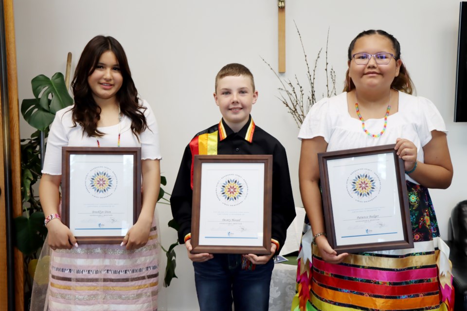 Lakeland Catholic students Brooklyn Dion, Destry Herald and Patience Badger (from left to right) received honourable mentions from the Alberta School Boards Association for the 2023 Honouring Spirit: Indigenous Students Award. On June 14, the trio was presented with framed certificates and a smudge kit during an intimate ceremony held at the Lakeland Catholic School Division's main office.