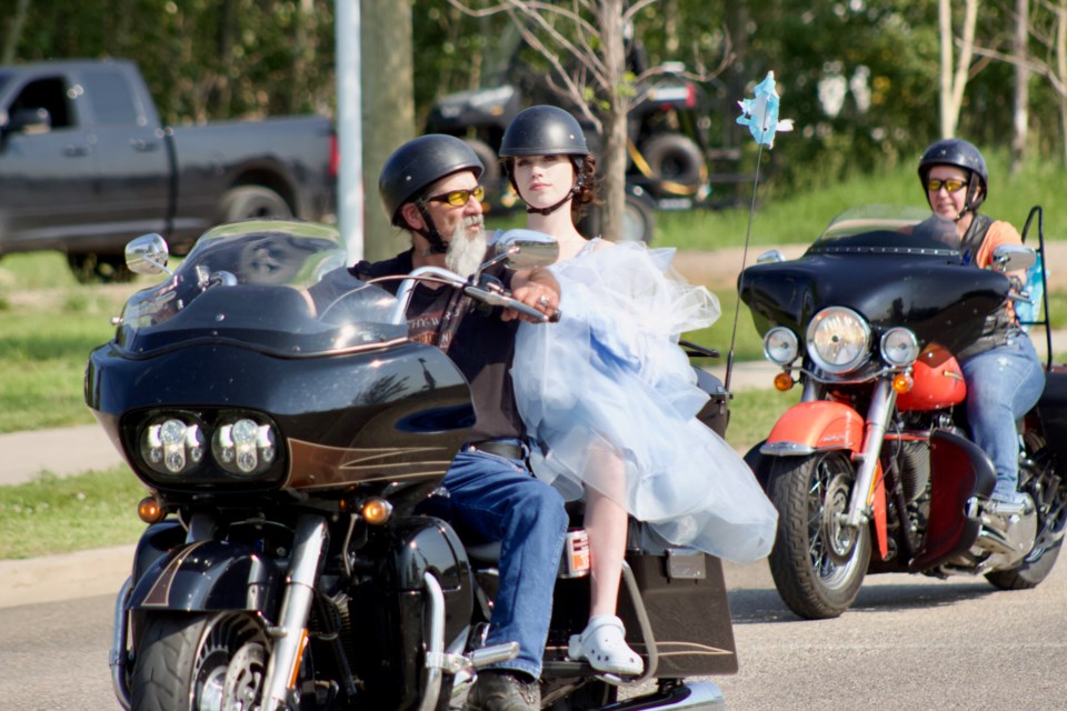 J.A. Williams High School 2022 Grad Amie Reynolds rides in style along the Grad parade with her grandfather Ray Fitzsimonds  who rolled in from Waseca, Sask with his wife (in background) Patty Milnthorp. 