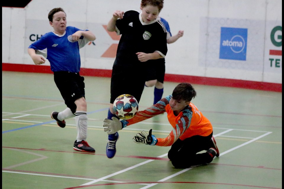 Bonnyville and St. Paul U13 Boys compete in the Lakeland Cup indoor soccer tournament on Saturday, Feb. 4, in the Graham Field House at the C2. St. Paul goalie Kaden Gervais dives for the ball. 