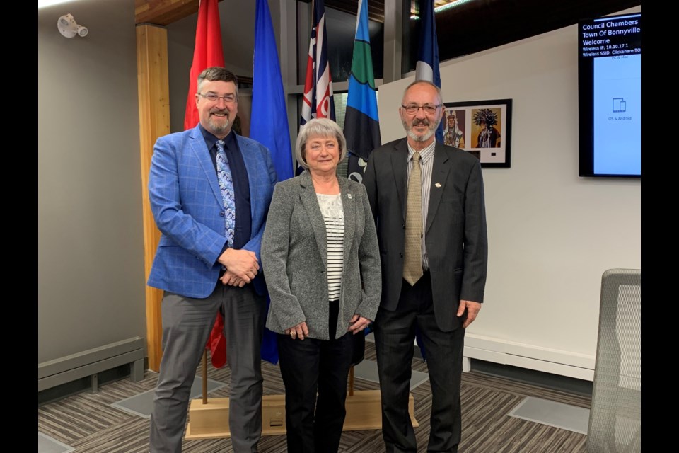 Mayor Gene Sobolewski an councillors Rene Van Brabant and Lorna Storoschuk stand together following their final council meeting for the Town of Bonnyville.