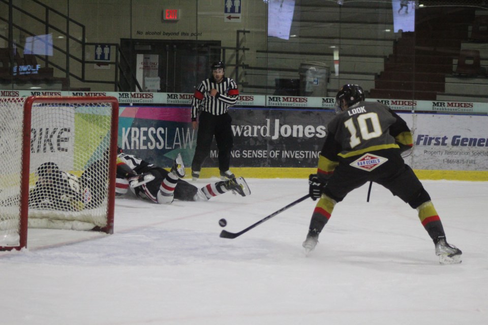 Pontiacs' forward Ethan Look scores an empty net goal with an assist from Trey Funk, against the Whitecourt Wolverines on Nov. 16.