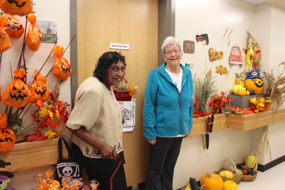 Maggie Savary (left) with the help of her neighbour Clara Metcalfe (right) created a spectacular seasonal display with items donated from friends and community members.