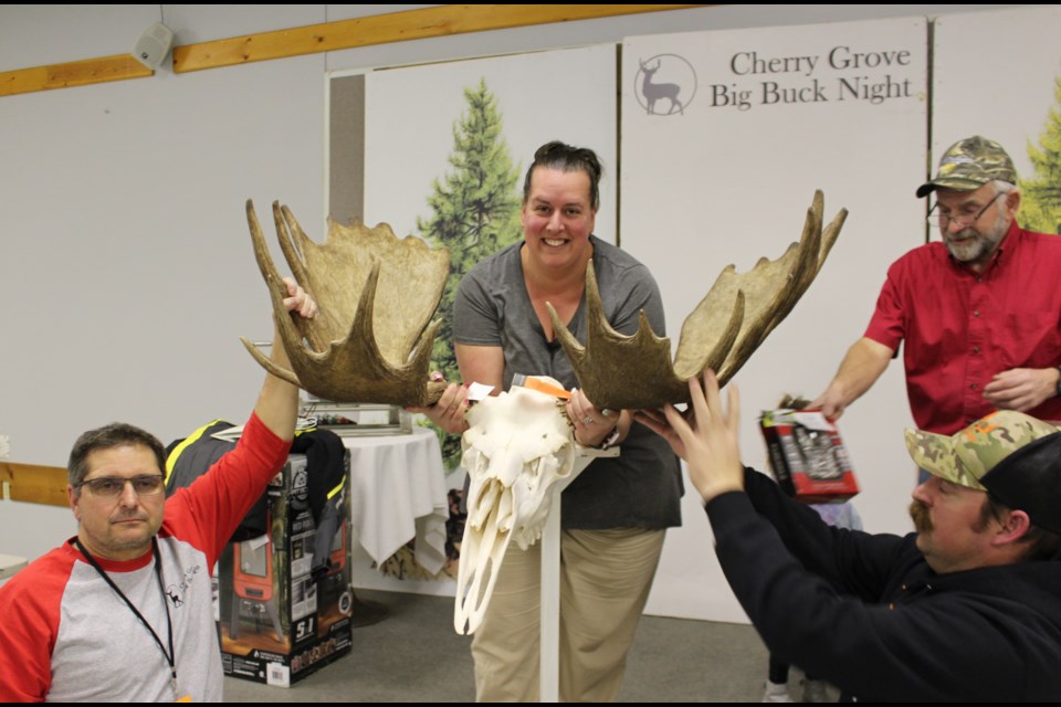 Sabrina Somers accepted the award for the biggest moose rack on behalf of her husband Andrew. His net score was 170 5/8.