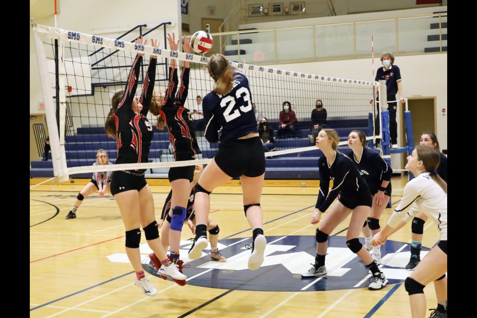 École Notre Dame player #23, Halle Blocha, attacking the ball during the  Saturday morning quarter-final game against Rimbey.