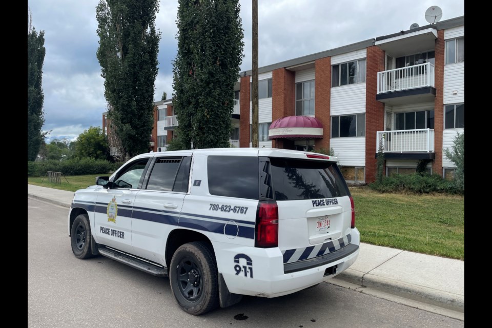 Lac La Biche County peace officers at Victoria Apartments on Aug.4. Following weeks of break-ins and unsafe living conditions for residents, the department is looking for solutions.