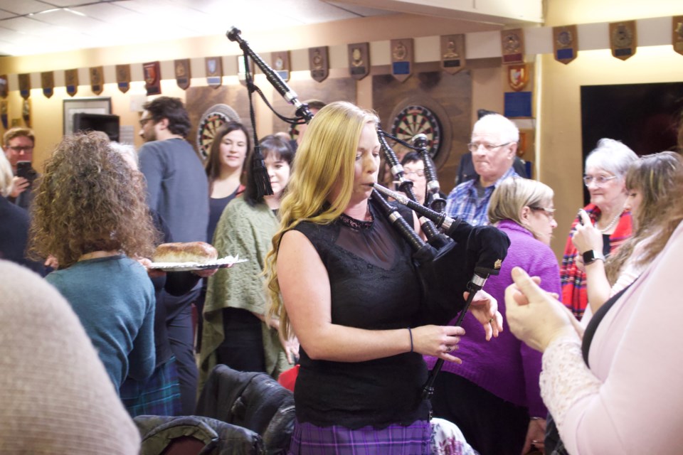 Haggis bearer, Ruth Fyten, and bagpiper, Molly Fyten, delivered the haggis delicacy to the head table as party-goers watched, at the second annual Robbie Burns event Saturday night.