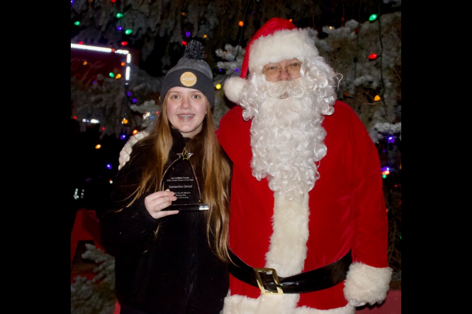 Volunteer and dance coach Samantha Onciul (left) was presented with the 2022 Junior Citizen of the Year Award during the annual Light Up the Night parade on Thursday in Lac La Biche.