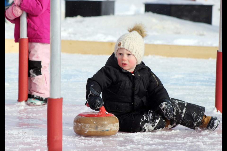 During the 2020 Snow Fever, two-year-old Sawyer Cronin didn’t quite get the hang of Crokinole.