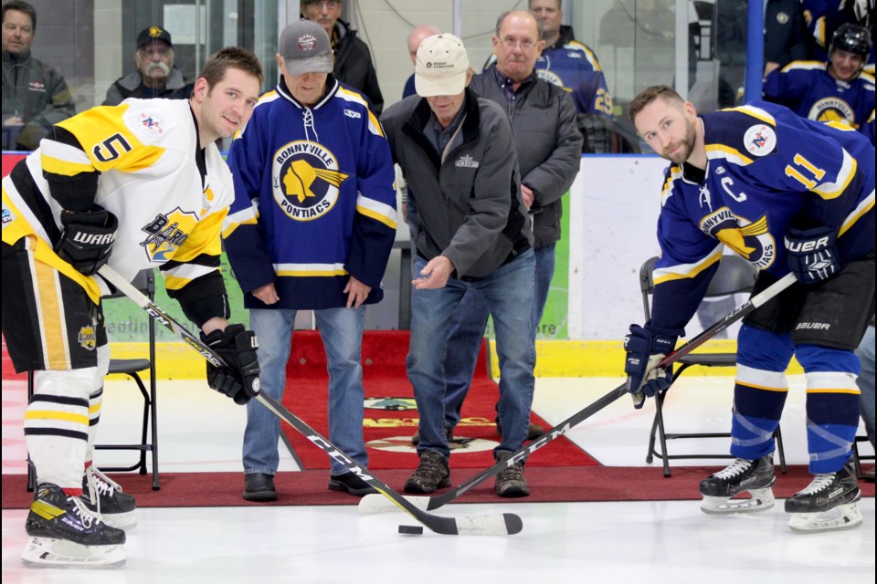 The Bonnyville Pontiacs' Laurier Sylvestre (center left) and Cliff ‘Getaway’ Galloway (center right) dropped a ceremonial puck for the Senior Pontiacs' 70th anniversary game on Friday, Dec. 16, at the RJ Lalonde Arena.