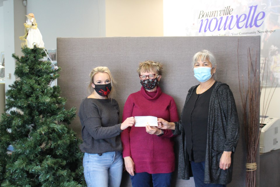 Outreach workers Lil Cardinal (right) and Hannah Casper (left), joined Jacki Kunec to collect a cheque from St. John’s United Church for the Bonnyville Outreach division of the Dr. Margaret Savage Crisis Centre (DMSCC).  