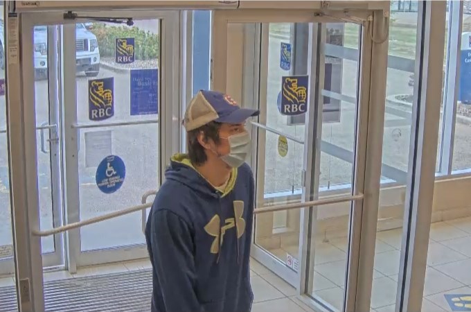 Police are releasing security footage of a male suspect alleged to have caused over $10,000 worth of damage to a Cold Lake RBC bank on May 9, 2022.