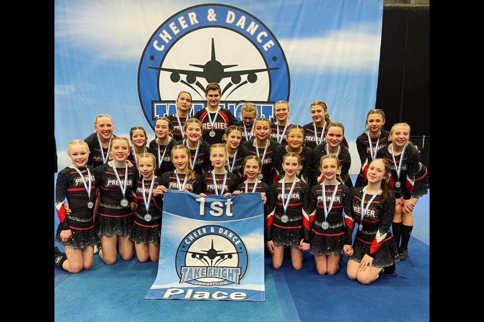 Premier Academy's Xplosion cheer team won first place in their division and left the Take Flight Competition with gold medals.