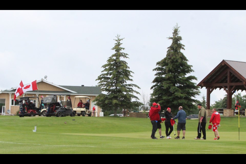 Teams dressed in red and white and carried Canadian flags during the July 1 Hole In One fundraiser at the Lac La Biche Golf Club