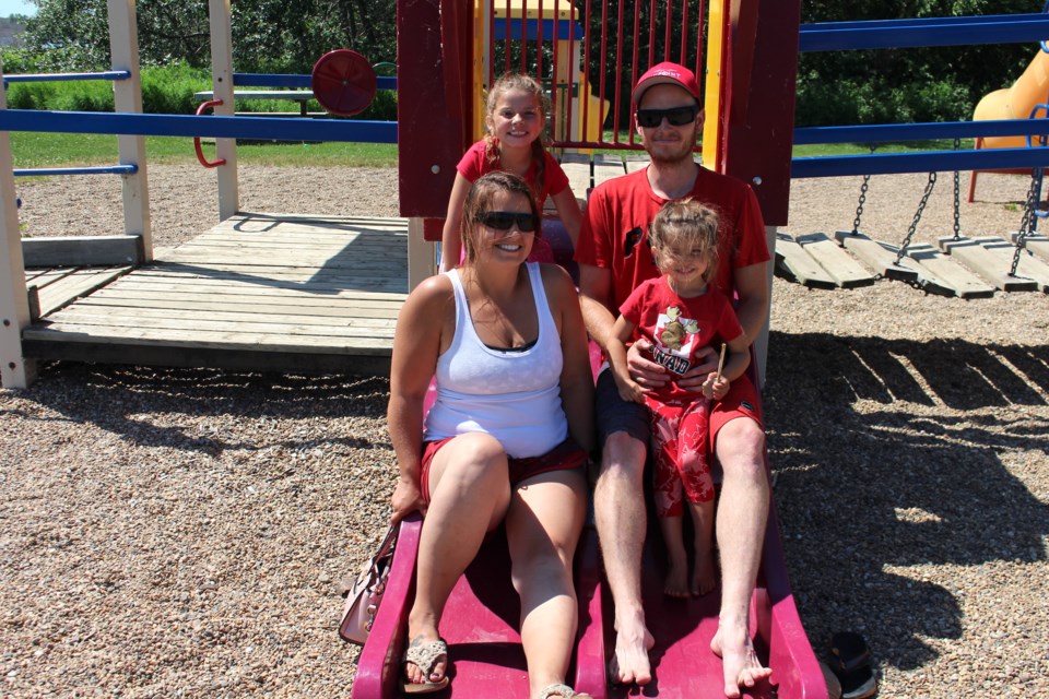 The Town of Bonnyville hosted a virtual scavenger hunt on Thursday, July 1. Teams headed out to do a number of missions, including taking a photo of the entire group on a slide like the Young family did here. 