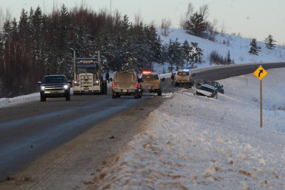 RCMP control traffic along a northern stretch of Highway 881 near Conklin after a crash on Tuesday at around noon. No serious injuries were reported and traffic was affected for about two hours