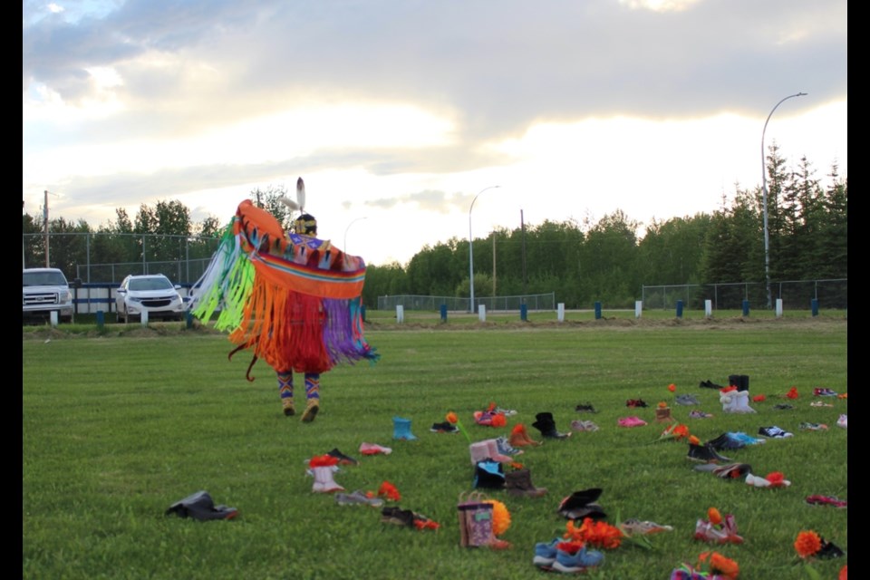 Dancer Alicia Cardinal performs a tribute dance at the Buffalo Lake Metis Settlement's 215 event on Thursday.