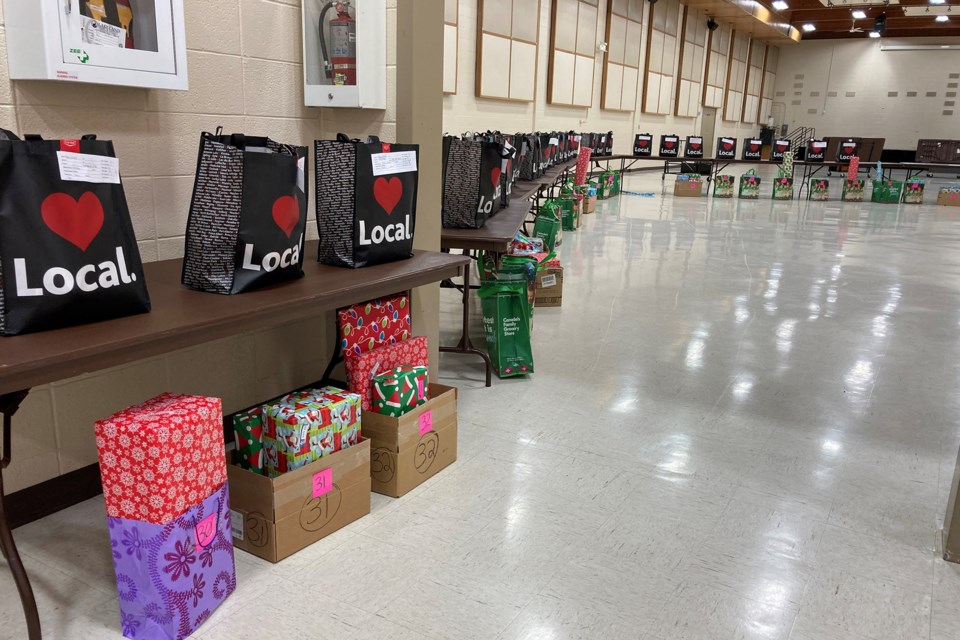 Hampers were lined up along the walls of the St. Paul Rec. Centre. Those in need were able to stop by the drive-thru service to gather food and gifts on Dec. 21. Photo supplied.