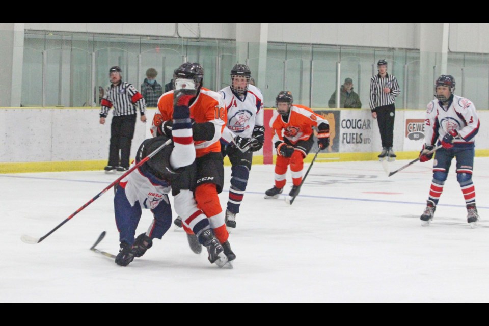 Clipper D-man Kannyn Gauthier gets up-ended by a Wainwright player in the recent NEAHL mathup.    Image: Rob McKinley