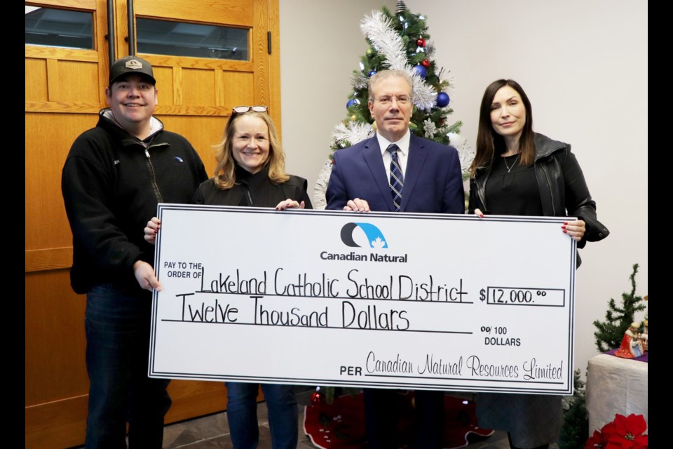 Submitted photo
On Dec. 18, CNRL representatives presented a $12,000 cheque to Lakeland Catholic School Division Superintendent of Schools Joe Arruda and Deputy Superintendent Chantel Axani. The funds will be used to support food programs within Lakeland Catholic Schools across the division.
