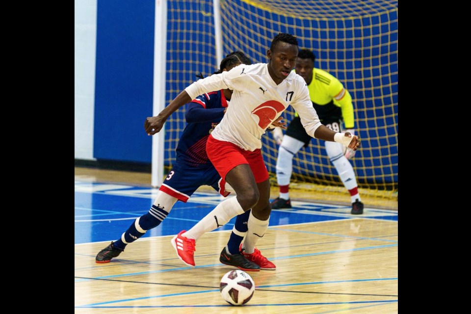 SAIT Trojans player Jolly Koppanomo takes on a Voyageur defender and turns to the Portage net during action from last year's futsal championships. This year's northern qualifiers will take over the Bold Center courts from August 10-12.
File — 