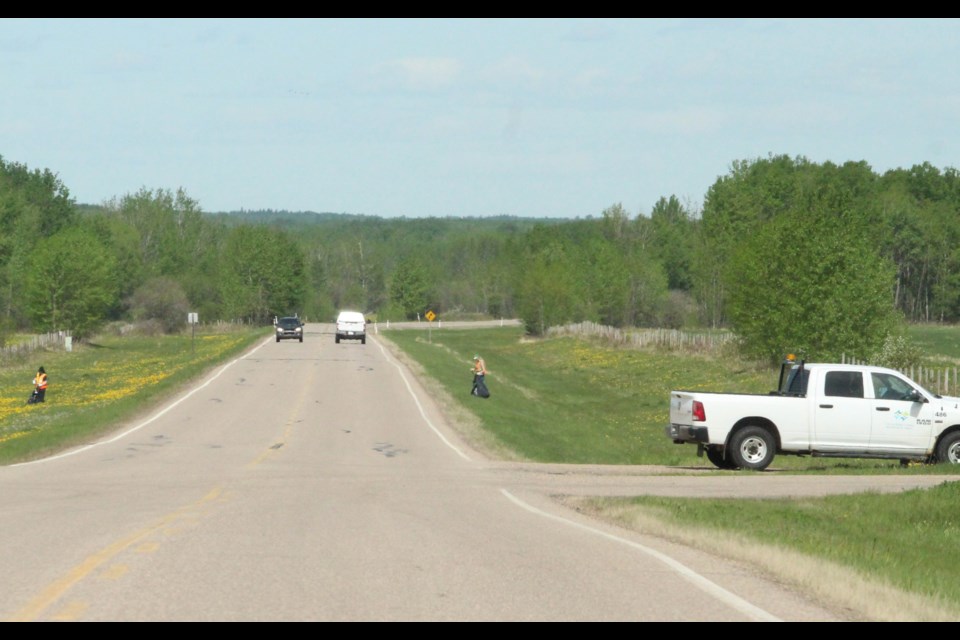 Summer workers were cleaning up municipal right of ways along the road into the Beaver Lake Cree Nation last week. Outdoor staff at the municipality and any residents needing to be outdoors in the next week need to take precautions due to the forecasted heat wave, say Environment Canada officials.