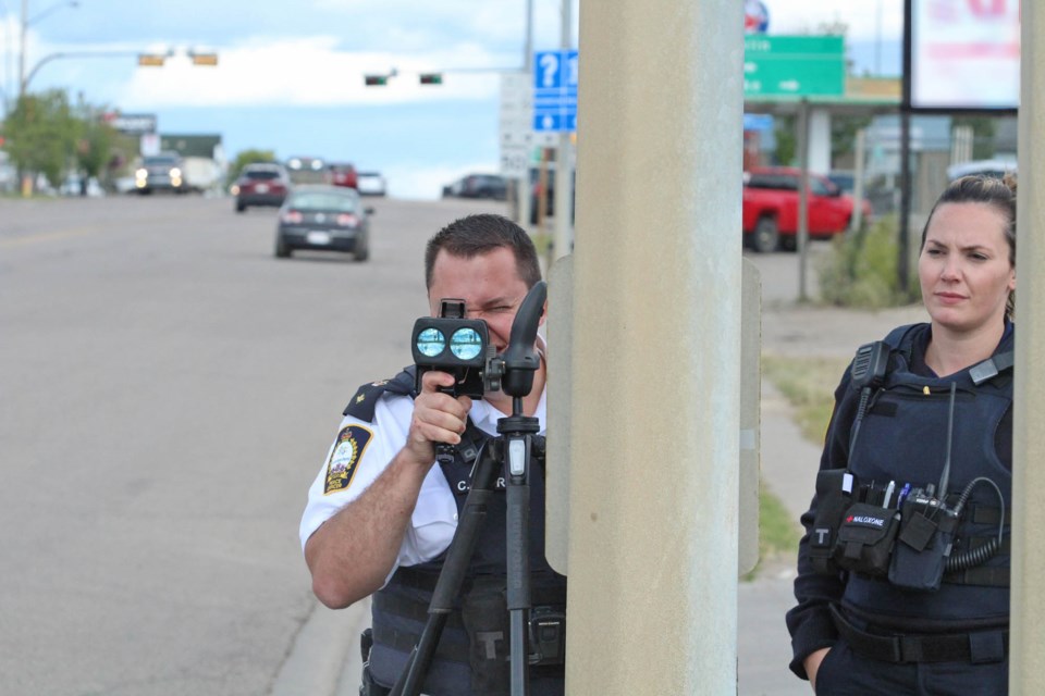 CPO Ashley Blanchard and enforcement services manager Chris Clark were monitoring the Main Street Lac La Biche school zone on Tuesday afternoon.
   Image: Rob McKinley