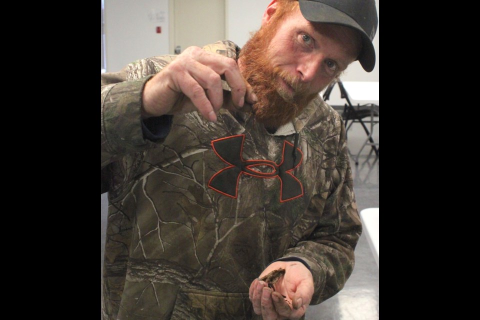 Vermicomposting workshop attendee Ed Thring shows off some of the stars of last week's composting session.