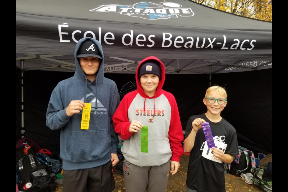 Oscar Fersovitch, Raven Neahr and Matthew Menard from École des Beaux Lacs are pictured with their ribbons.