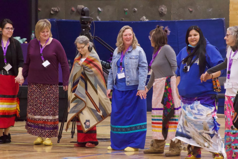 Portage College President Nancy Broadbent (centre) is among other staff, students and invited guests during a round dance on Friday during the opening of the college’s new Cultural Space.