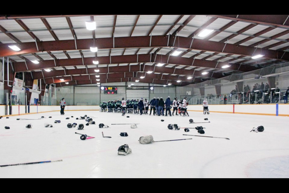 The debris of victory. Sticks, gloves and helmets from the provincial-title winning Springbank Rockies' players litter the Plamondon Arena ice following the 8-3 win.