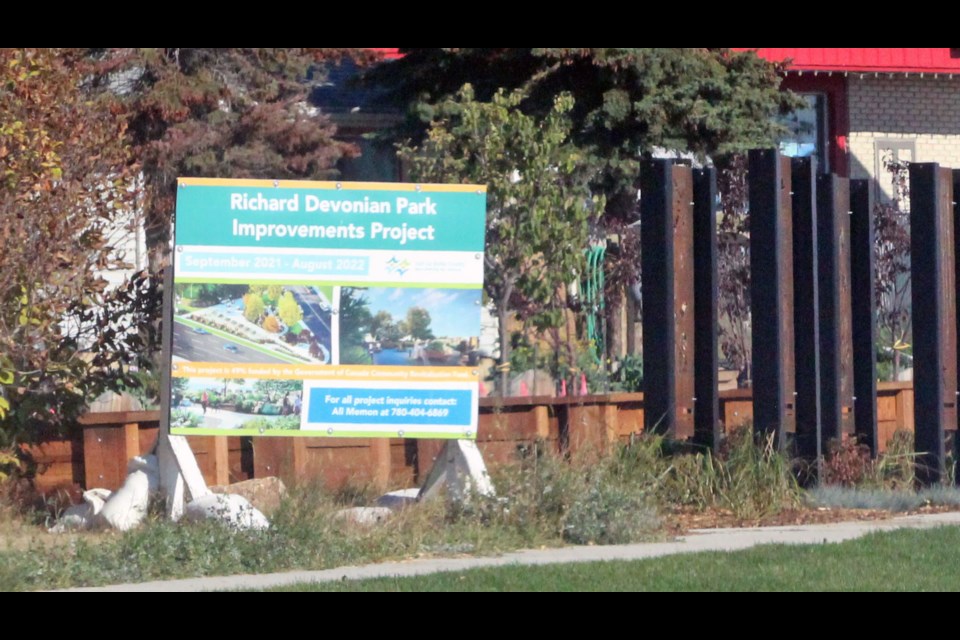 The big construction sign and some unkempt grass are taking away from the new Main Street greenspace, says the mayor.