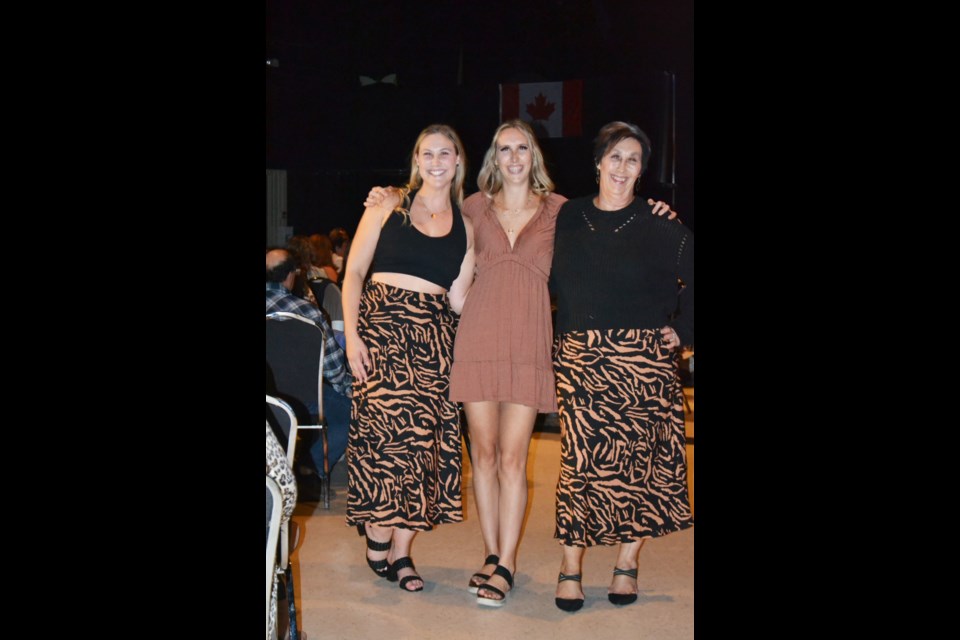 All dressed up in styles from Elle Rain Boutique, this trio is set for a night to remember.