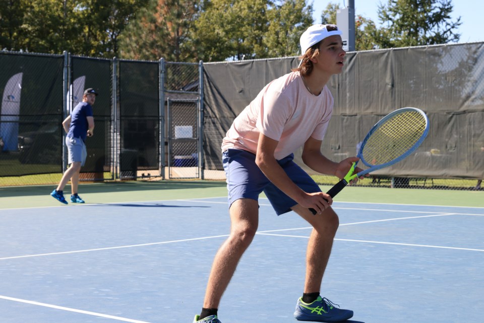 Kurt Poulin (front) and Seth Cousins play in the finals in the doubles category.