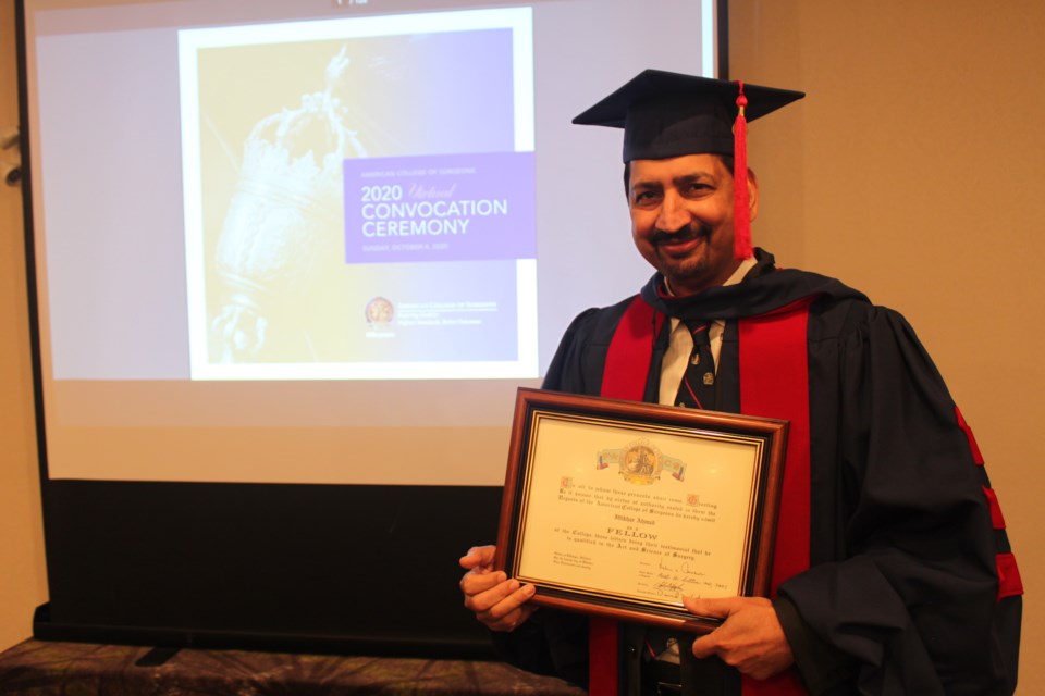 Dr. Iftikhar Ahmad was inducted a Fellow into American College of Surgeons Oct. 4. Clare Gauvreau photo.