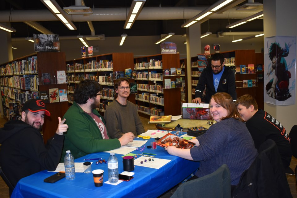 People playing Dungeons and Dragons. 