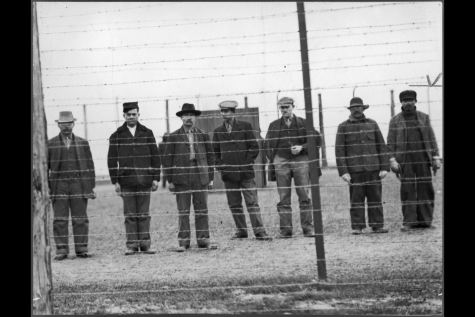 Five detention centres operated as receiving stations, where internees were held until their relocation to longer-term facilities. These prisoners are at one such station, located at Stanley Barracks, on the grounds of the Canadian National Exhibition in Toronto, Ontario.
