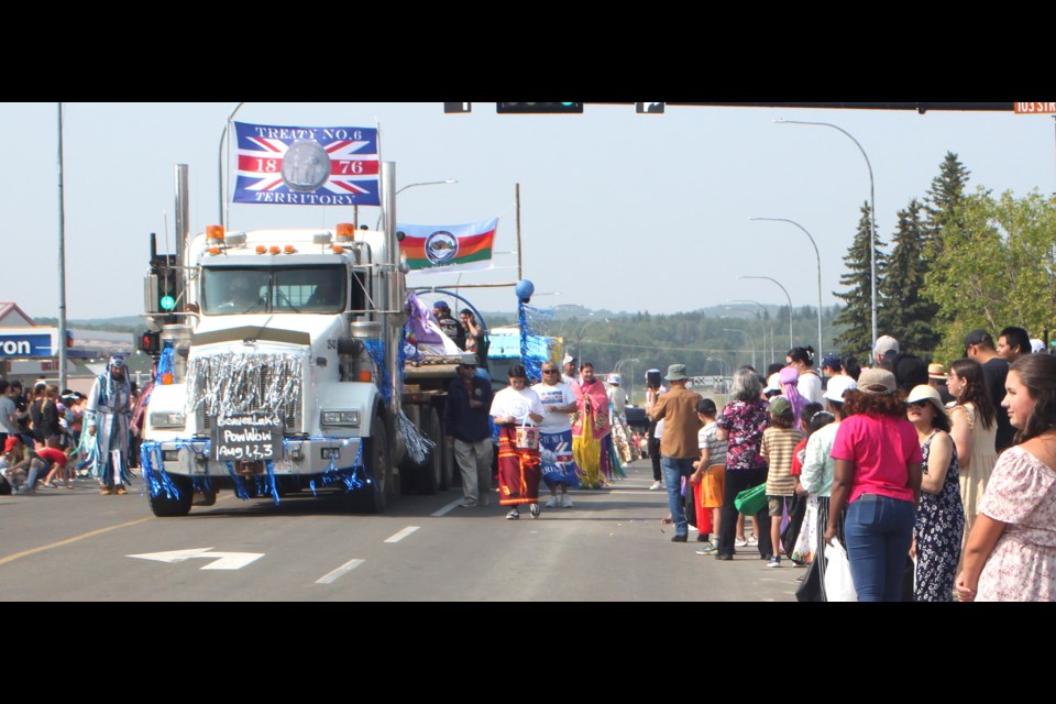 A tractor trailer bearing the Treaty Six flag moves down Main Street. Chris McGarry photo. 