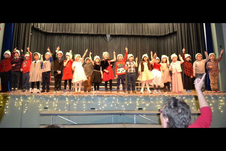 Elk Point Elementary School’s first time entertainers, the Kindergarten class, was led through their performance of “I Want To Be An Elf’ by their teacher, Debbie Wood.