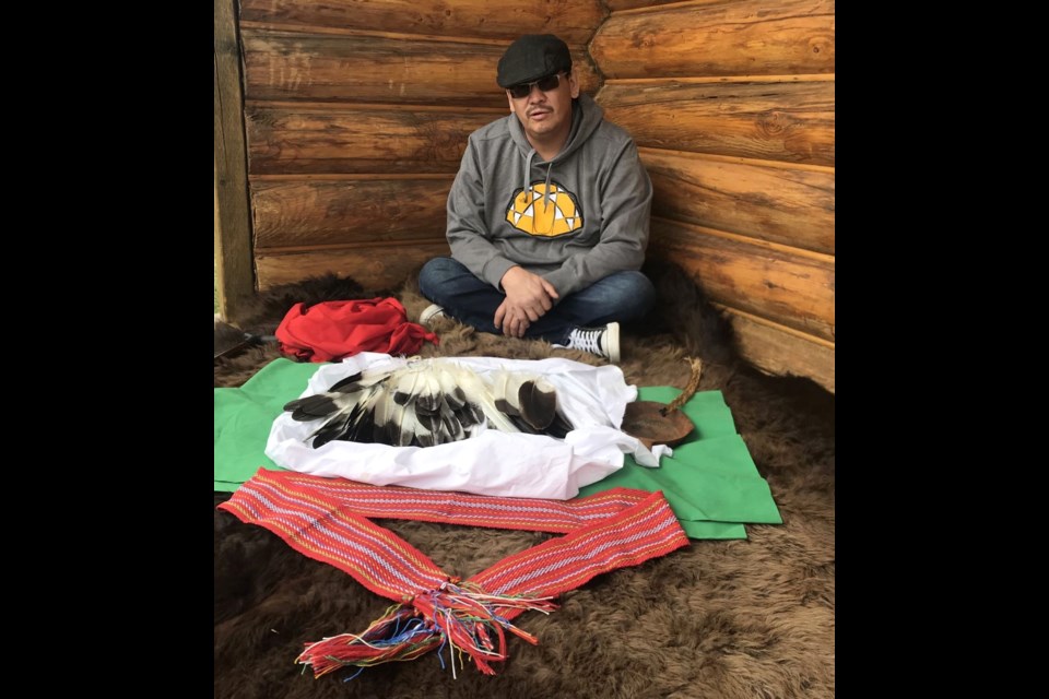 Knowledge Keeper Eric Daniels with the golden eagle feathers that have been sent to some Portage College 2020 graduates.      Photo: Robert Rayko /